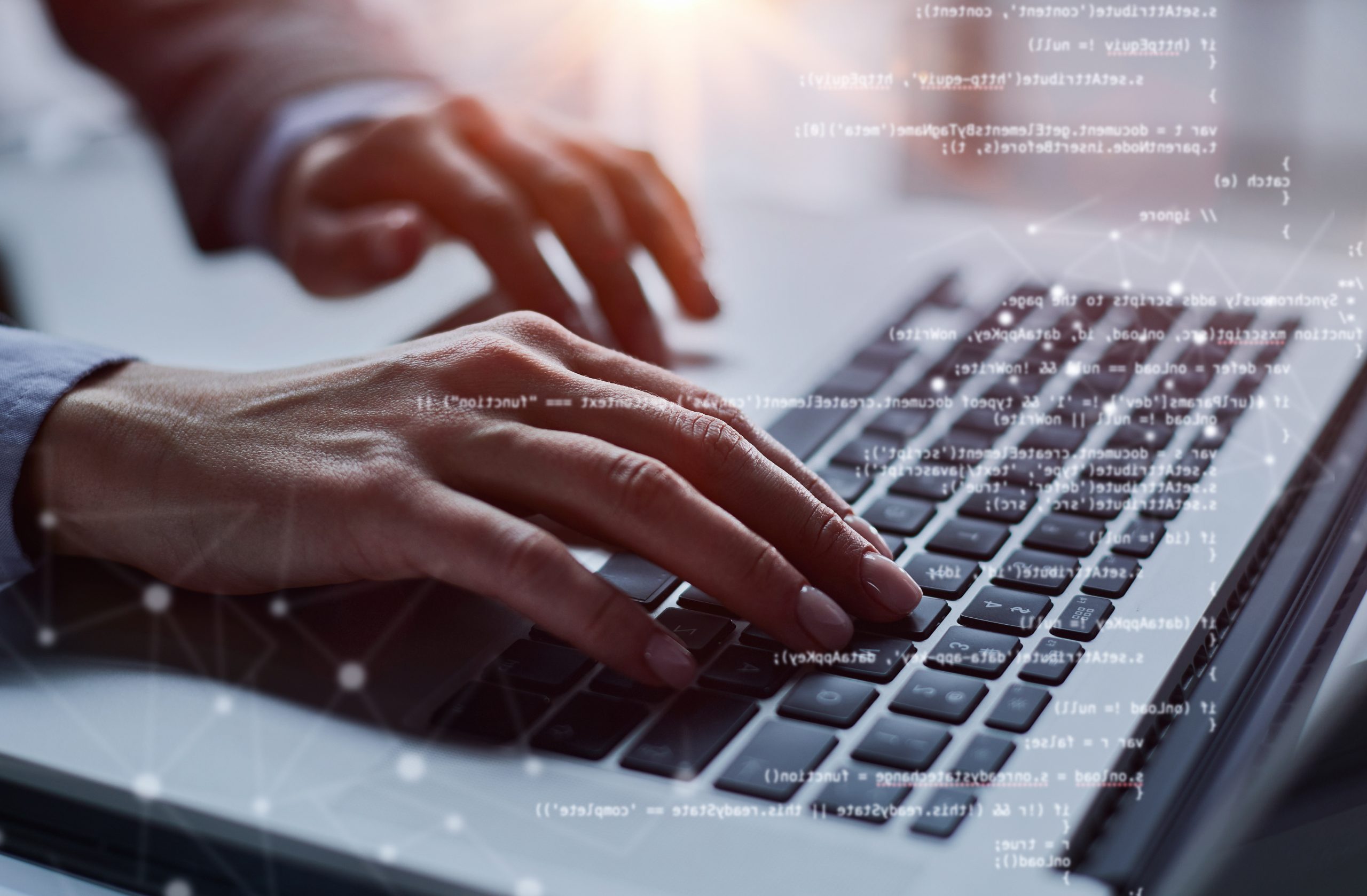 Close-up of male hands using laptop at office